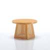 Wooden side table with wicker basket design on a white background