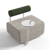 Modern ottoman with a small round table and green backrest on a white background