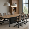 Modern conference room with a long wooden table and chairs near large windows.