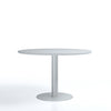 Round white table on a white background
