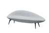 Modern, quilted ottoman with black legs on a white background