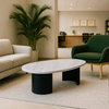 Modern living room with a coffee table, sofa, and chair.