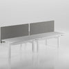 Two white desks with gray partition screens on a light gray background