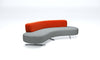 Modern bench with orange and gray sections on a white background