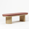 Modern bench with pink cushion on a white background