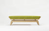 Green bench with wooden frame on a white background