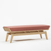 Bench with pink cushion on a white background