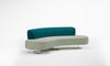 Modern sofa with teal and gray cushions on a white background