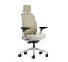 Beige office chair with headrest on a white background