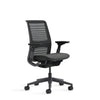 Black office chair with mesh back on a white background